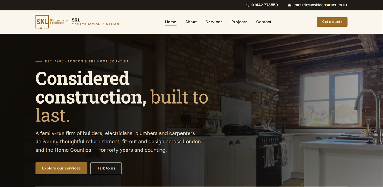 The SKL Construct homepage: 'Considered construction, built to last', over a warm photo of a renovated kitchen